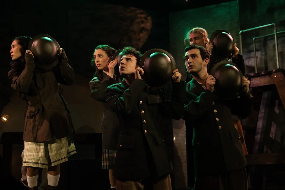 Alice by Heart — key production image, lit on scroll.