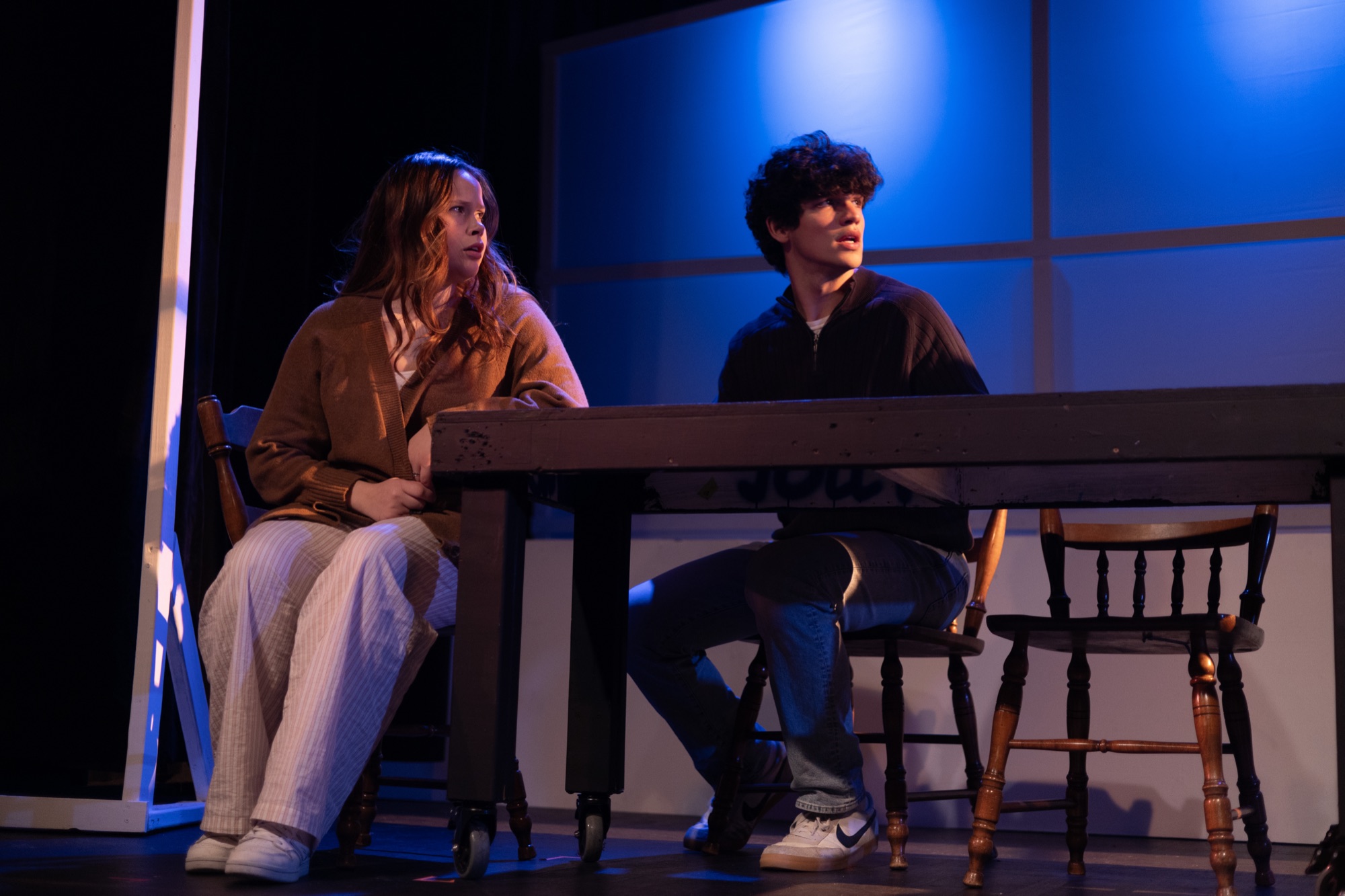 Next to Normal — key production image, lit on scroll.